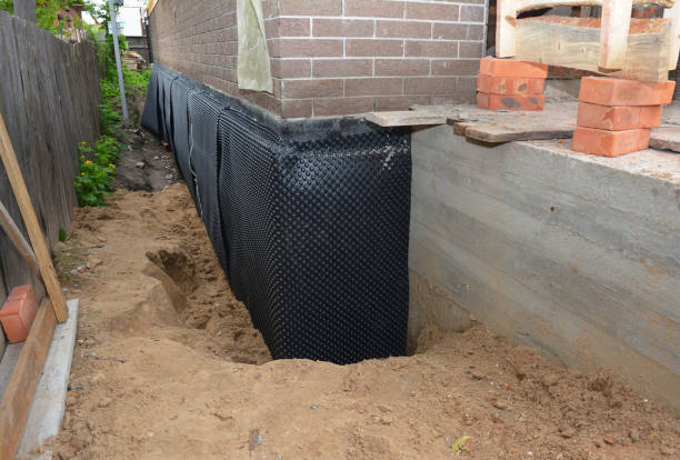 SJ Waterproofing Pros technician performing targeted Waterproofing assessment in Wolcottville, IN